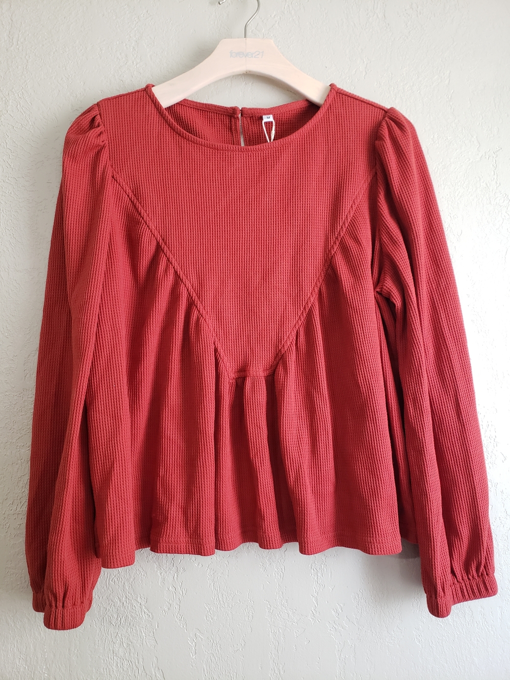 Women’s Long-Sleeve Peplum Knit Top